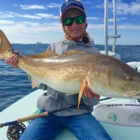 young angler with a great bull redfish in choctawhatchee bay