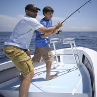 dad helps steady the rod dad helps steady the rod