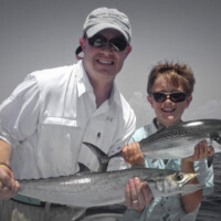 dad and son double up off rosemary beach Florida dad and son double up off rosemary beach Florida